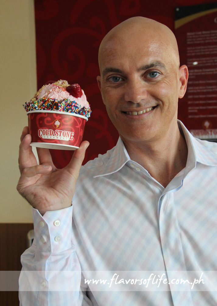 Michael McGill, president, holding up a generous cup of Our Strawberry Blonde