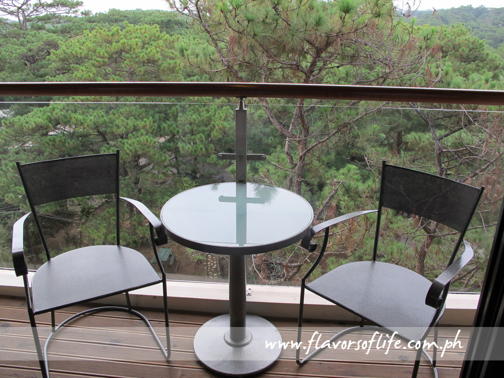 The veranda of our Deluxe Room on the fifth floor, overlooking Camp John Hay's picnic area