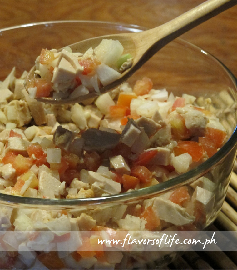 Side dish of chopped salted eggs, onions and tomatoes