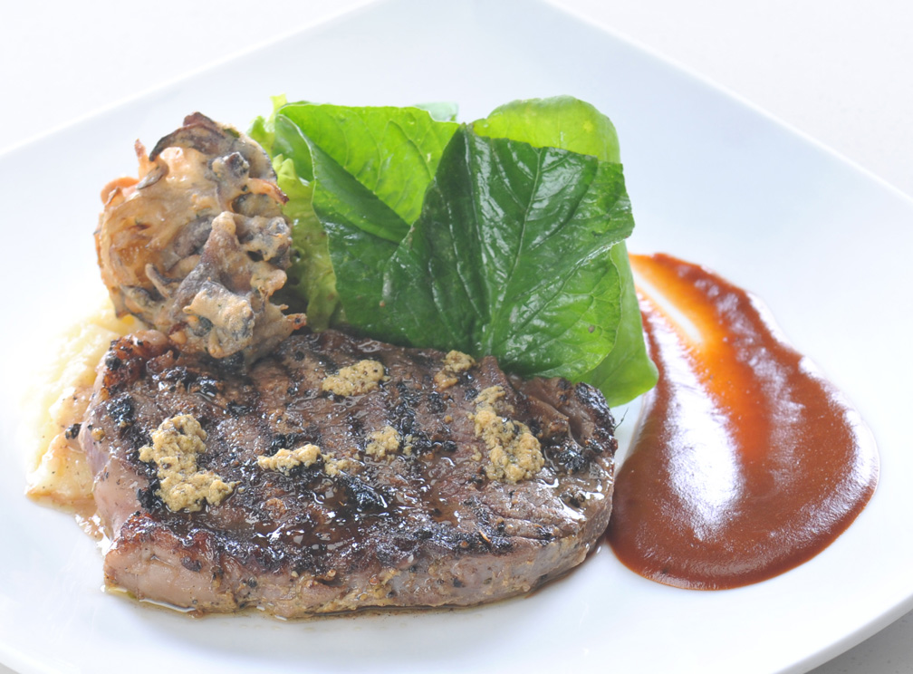 Roasted Rib-eye STeak with Onions and Portabello Confit served with Potato Puree & Classic Brown Sauce