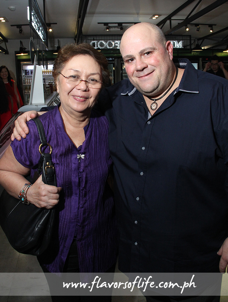 The Cravings Group founder Susana 'Annie' Guerrero and Di Bella Coffee owner Phillip Di Bella seal the partnership that aims to bring the premium Aussie coffee experience to the Philippines