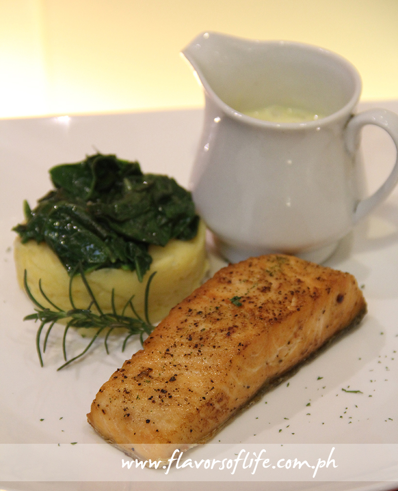 Baked Salmon Fillet, Wilted Spinach, and Orange Rosemary Beurre Blanc (Cravings)