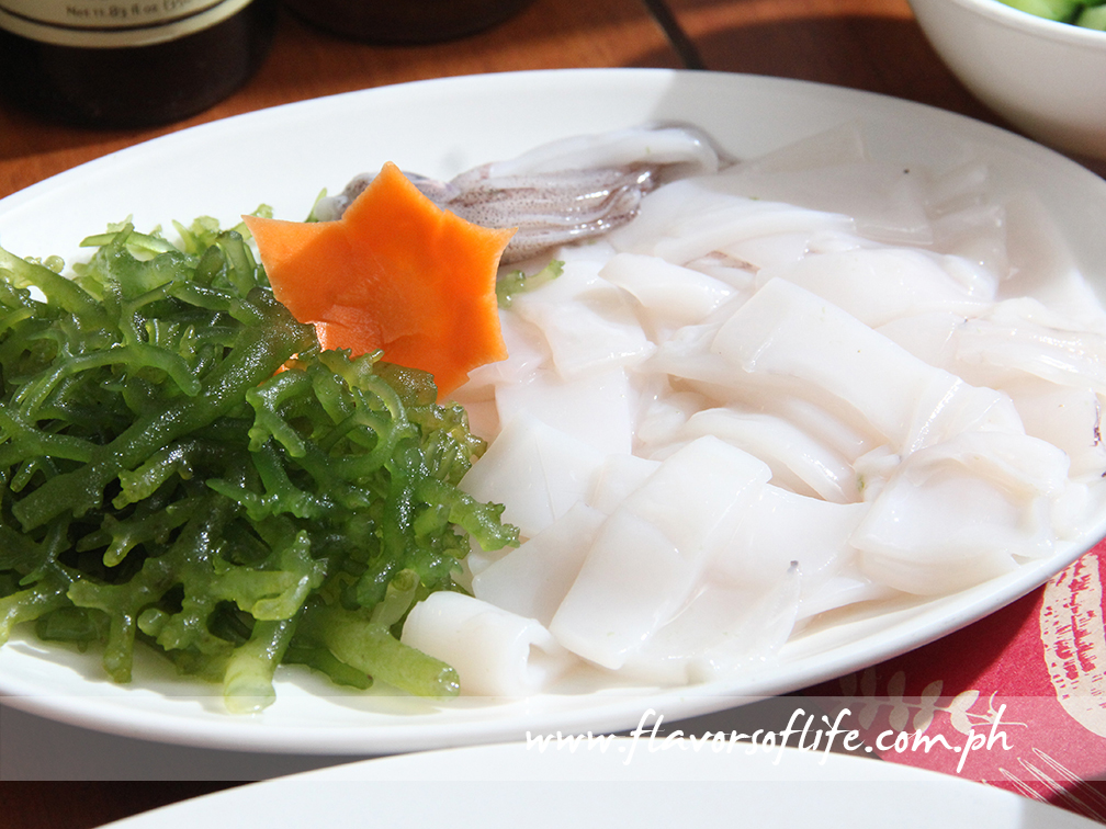 Thinly sliced raw squid for the 'kinilaw'