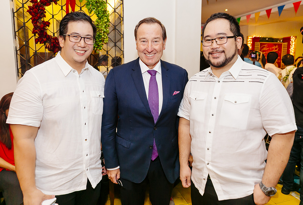 Aaron and Clifford Aw flank Marco Polo Ortigas GM Frank Reichenbach