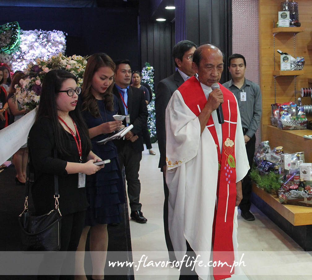 Priest blessing the store premises