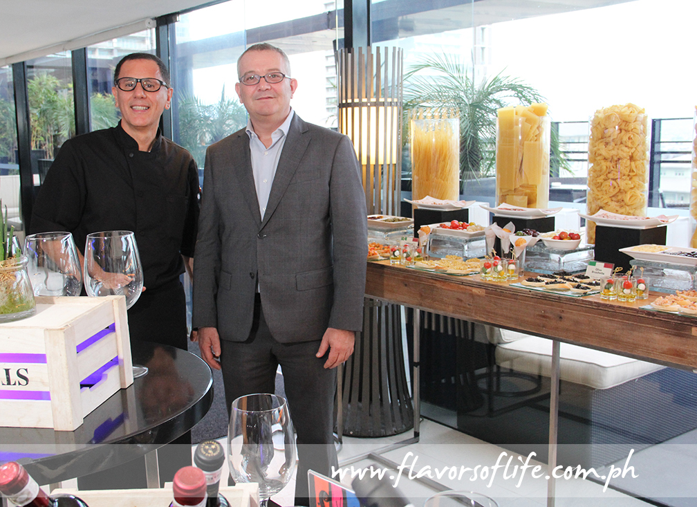 Italian guest chef Salvatore del Vincentis, here seen with Seda Hotel BGC's general manager Andrea Mastellone, prepares a good apericena spread of authentic Italian regional dishes