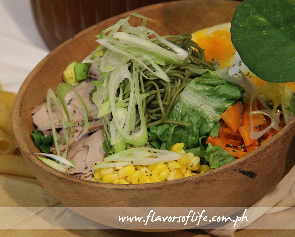 Green Pastures' Chasu Misoba Salad consists of mixed greens, cold buckwheat noodles, corn, 8-hour roast pork, avocado, roasted carrots, leeks and scallions